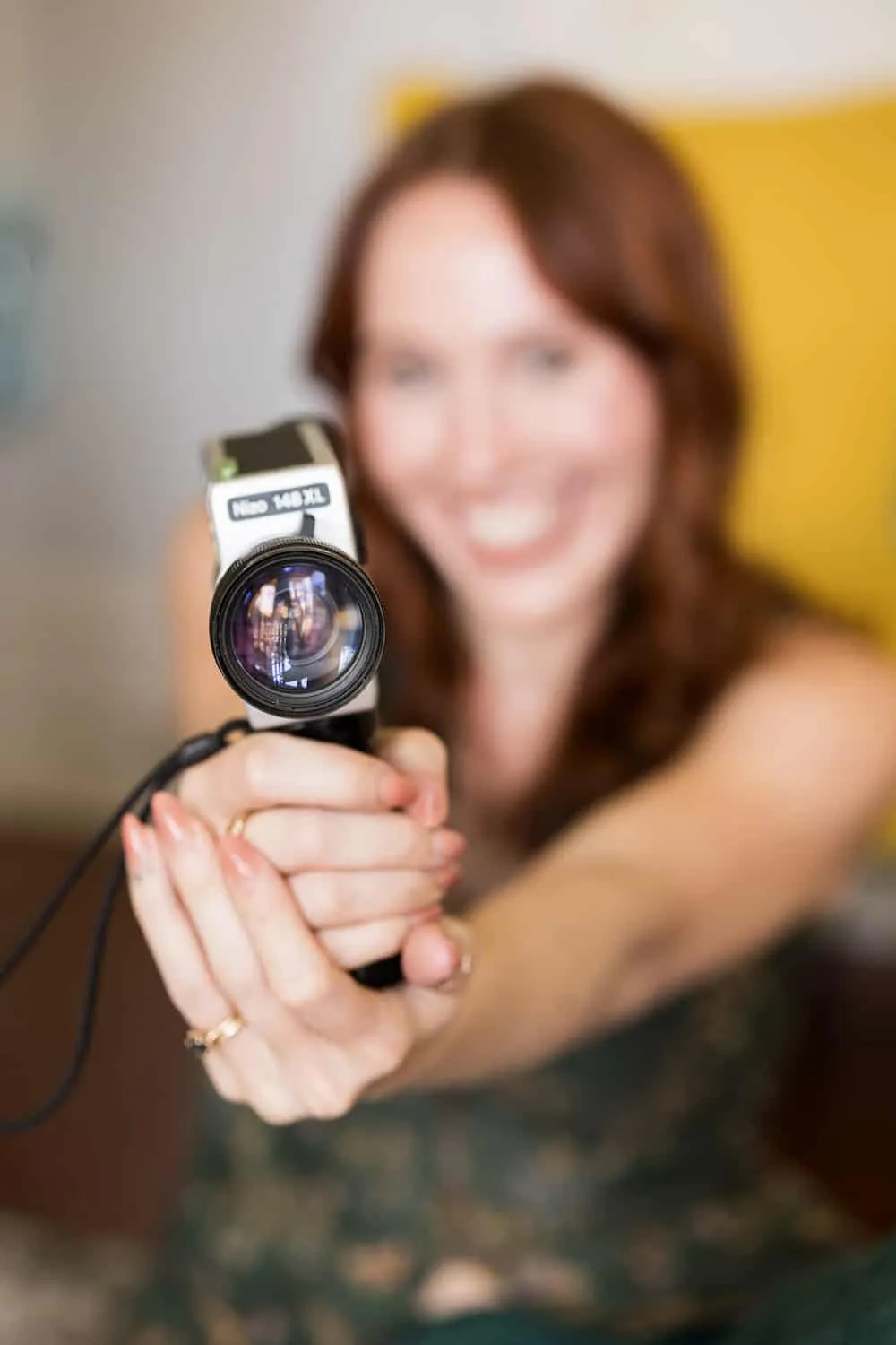 Ken holding her film camera towards you
